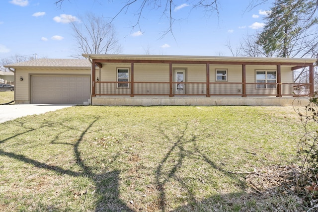 view of front of home with a garage, driveway, a porch, and a front yard