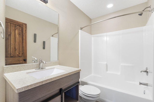 bathroom featuring shower / bathing tub combination, vanity, and toilet