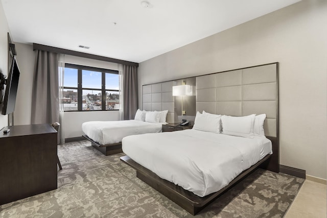 bedroom with visible vents and baseboards