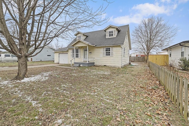 view of front of house with roof with shingles, an attached garage, crawl space, fence, and driveway