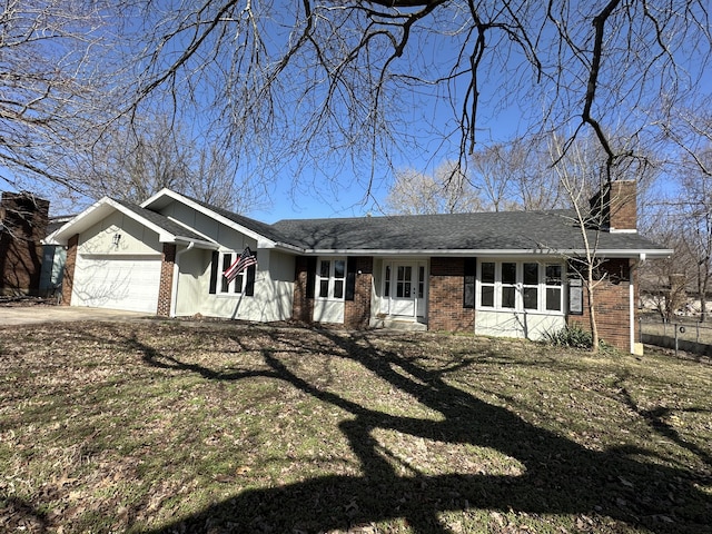 single story home with a garage, brick siding, a shingled roof, a front lawn, and a chimney