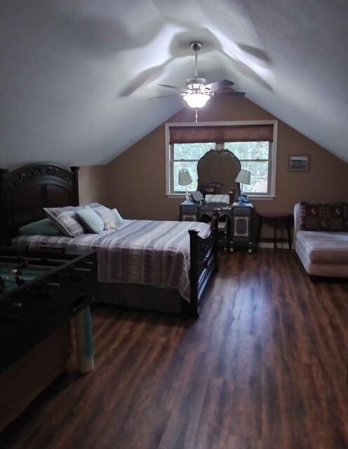 bedroom with a ceiling fan, lofted ceiling, and dark wood finished floors