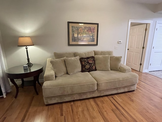 living room featuring light wood-style floors and baseboards