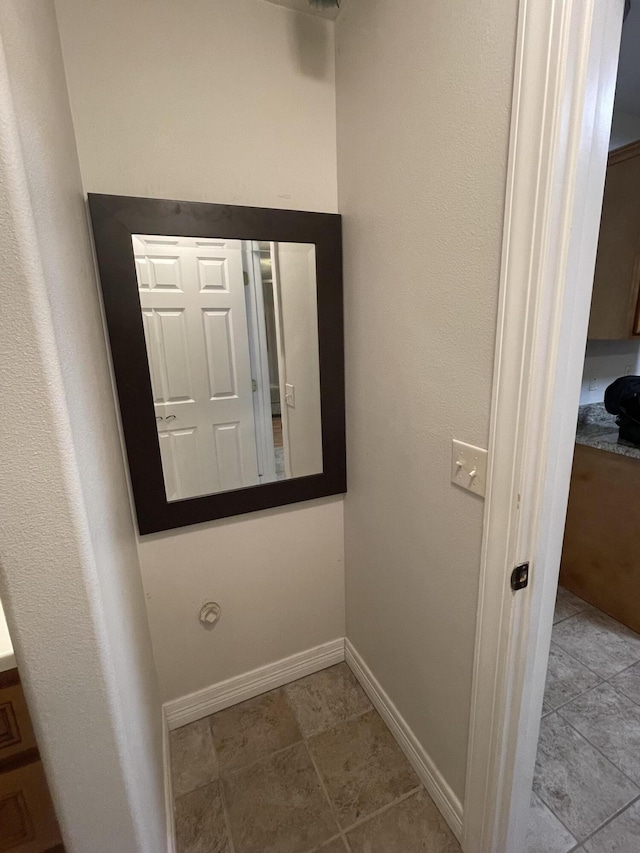 interior space featuring baseboards