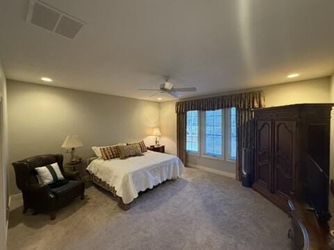 carpeted bedroom featuring recessed lighting, visible vents, baseboards, and a ceiling fan