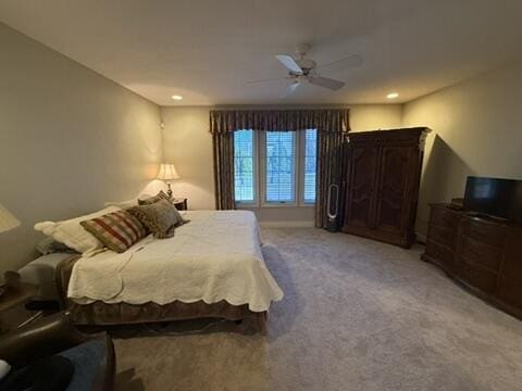 bedroom featuring ceiling fan, recessed lighting, and light carpet