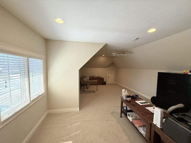 office with visible vents, baseboards, recessed lighting, vaulted ceiling, and light carpet