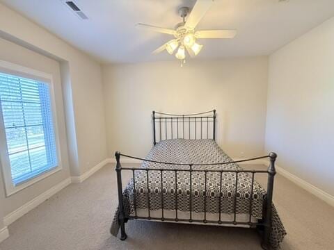 bedroom with visible vents, baseboards, and carpet flooring