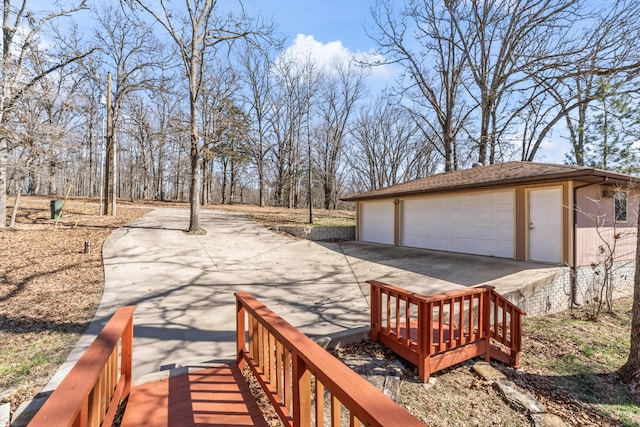 surrounding community with a garage and an outdoor structure