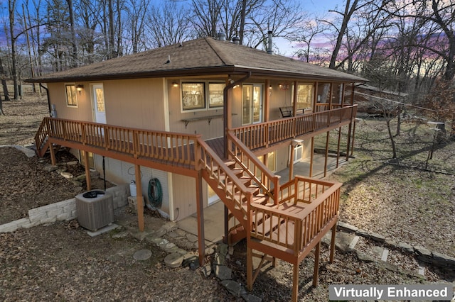 back of house with a shingled roof, central AC, a patio, and a deck