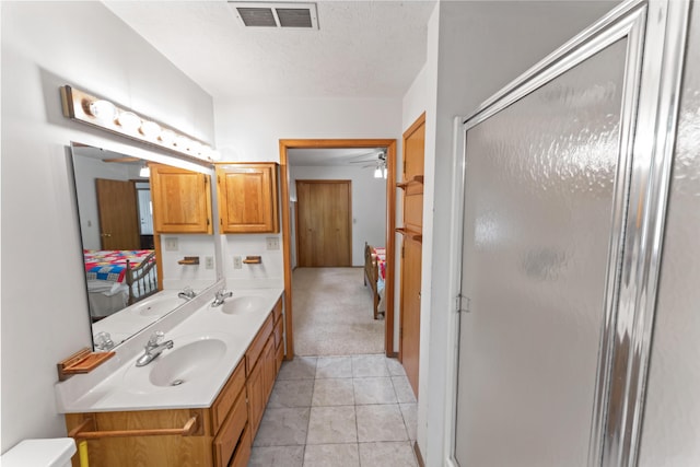 24311 Raintree Ln, Shell Knob, MO 65747 - bathroom with ensuite bath, ceiling fan, a shower stall, double vanity, and a textured ceiling