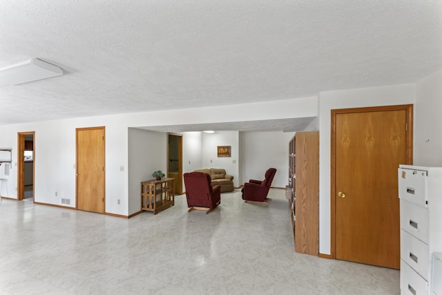 24311 Raintree Ln, Shell Knob, MO 65747 - living area featuring a textured ceiling and baseboards