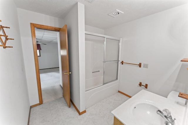 24311 Raintree Ln, Shell Knob, MO 65747 - full bath with baseboards, enclosed tub / shower combo, marble look tile flooring, and vanity