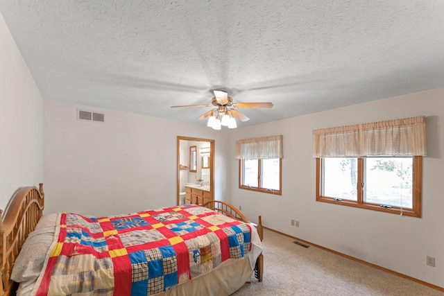 24311 Raintree Ln, Shell Knob, MO 65747 - bedroom with light carpet, baseboards, a textured ceiling, ceiling fan, and connected bathroom