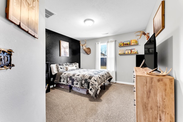 bedroom featuring carpet floors, baseboards, and visible vents