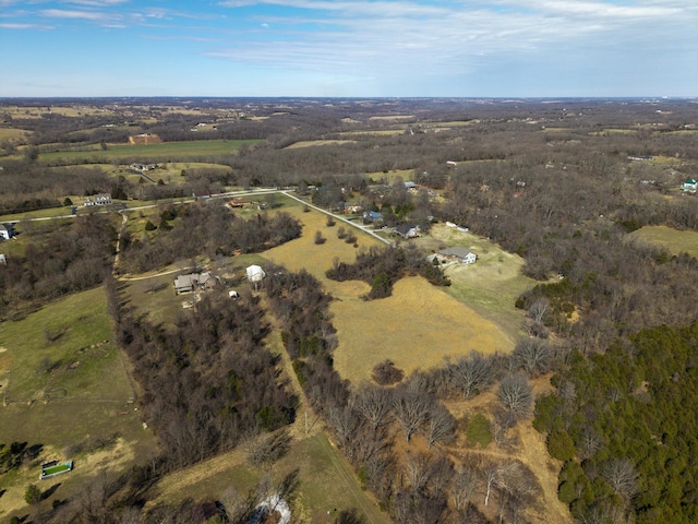 birds eye view of property with a rural view