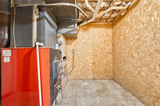 utility room featuring heating unit