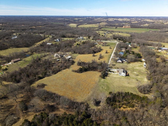 birds eye view of property with a rural view