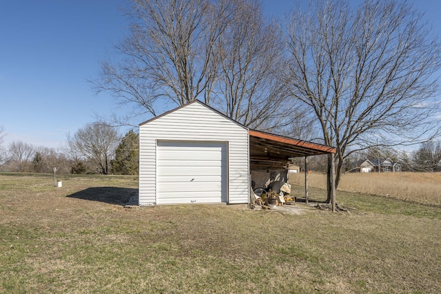 garage featuring driveway and a detached garage