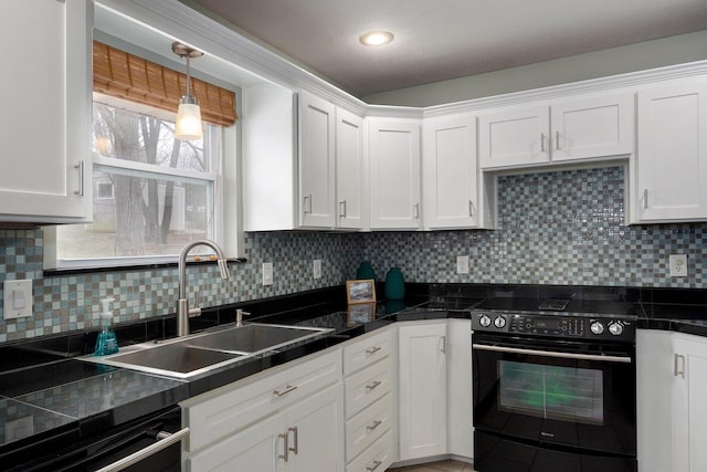 kitchen with black range with electric stovetop, decorative backsplash, white cabinetry, a sink, and dishwasher