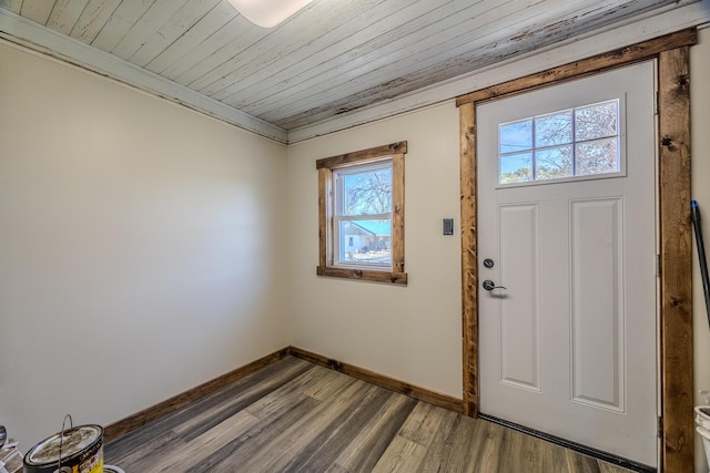 foyer with wooden ceiling, wood finished floors, and baseboards