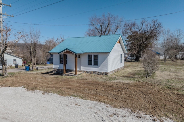 bungalow-style house with metal roof