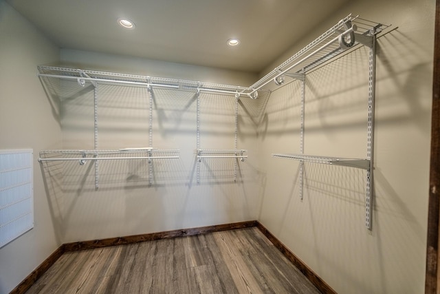 spacious closet with wood finished floors