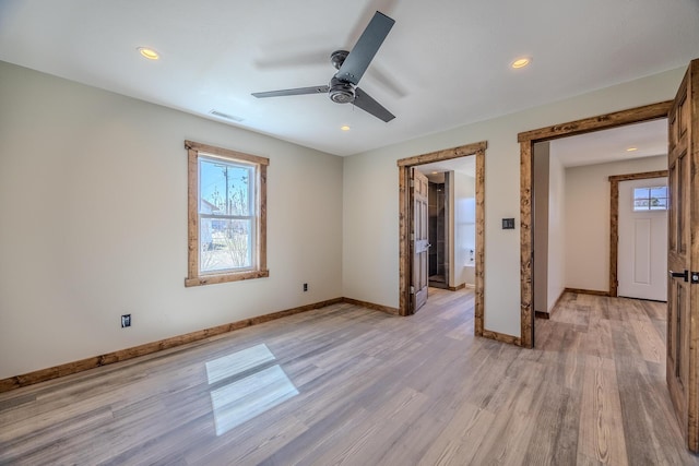 unfurnished bedroom featuring light wood-style flooring, visible vents, baseboards, and recessed lighting