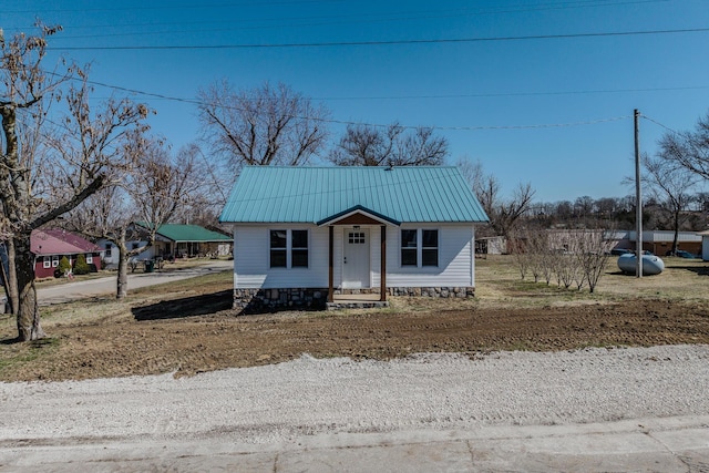 bungalow-style house featuring metal roof