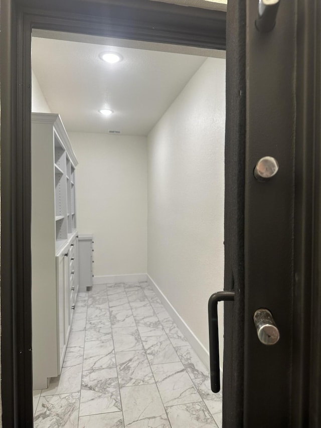 interior space with marble finish floor and visible vents