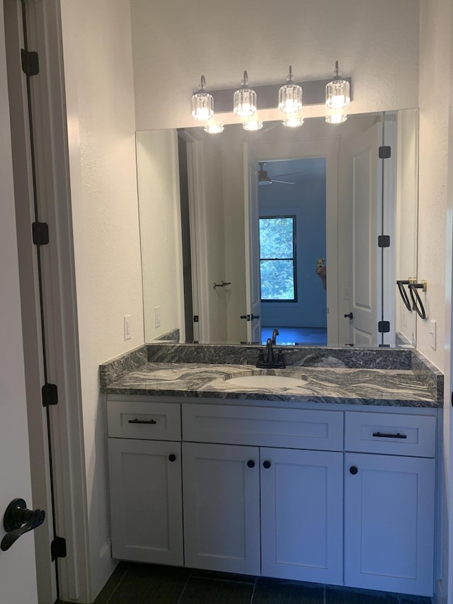 bathroom featuring tile patterned floors and vanity