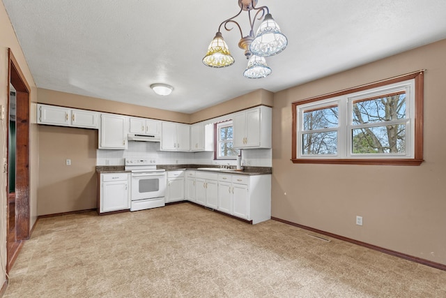 kitchen featuring dark countertops, white cabinets, electric stove, and under cabinet range hood