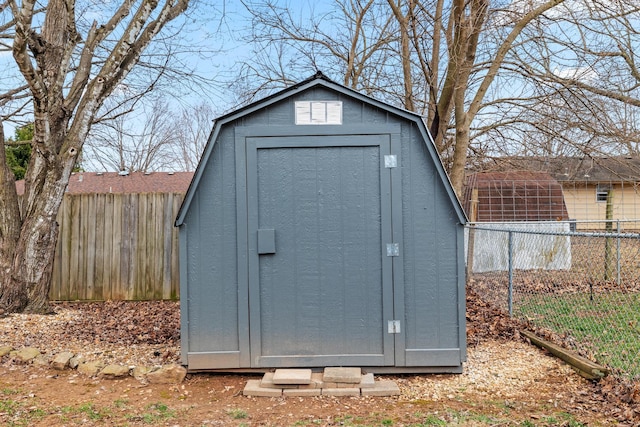 view of shed with fence