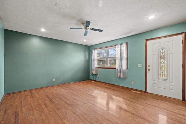 foyer with recessed lighting, a textured ceiling, wood finished floors, and a ceiling fan