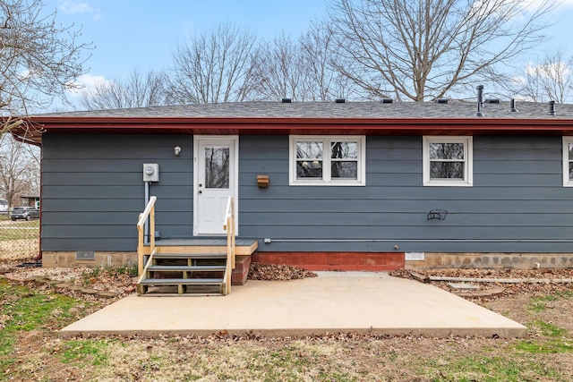 back of house featuring a shingled roof, a patio, fence, and crawl space