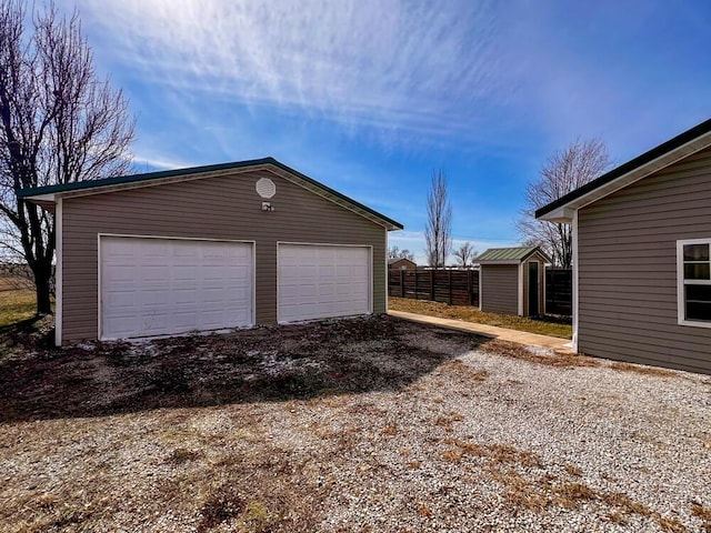 detached garage with fence