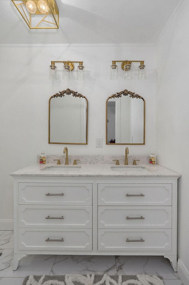 bathroom featuring a sink, baseboards, marble finish floor, and double vanity