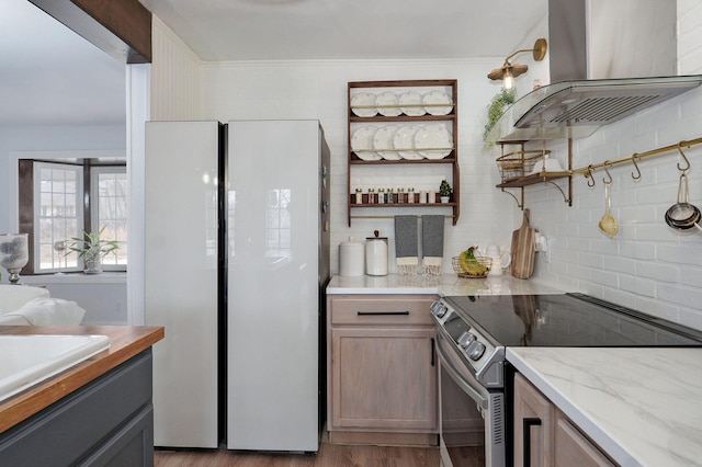 kitchen featuring electric stove, open shelves, tasteful backsplash, wood finished floors, and island range hood