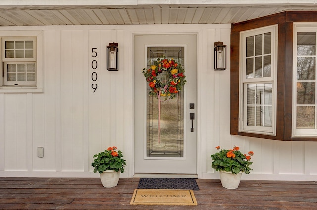 view of exterior entry with a porch