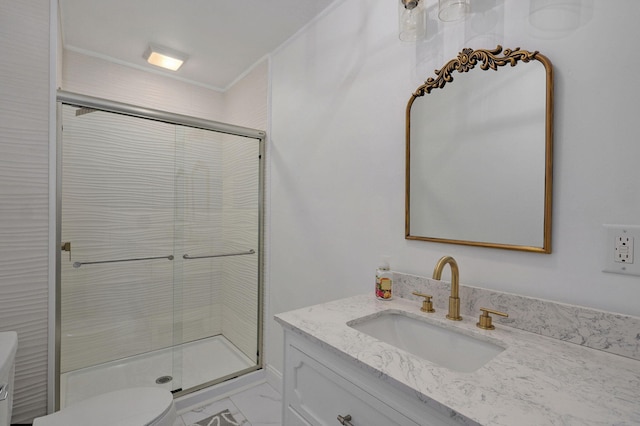 bathroom featuring toilet, a stall shower, vanity, and crown molding