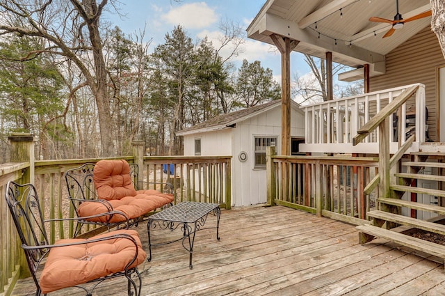 deck with stairs and ceiling fan