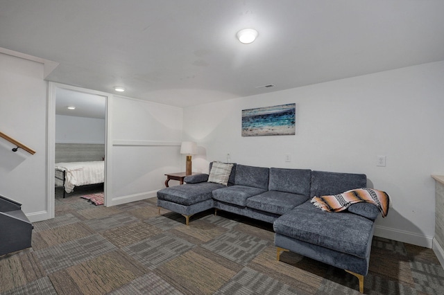 living room featuring visible vents, baseboards, and carpet floors