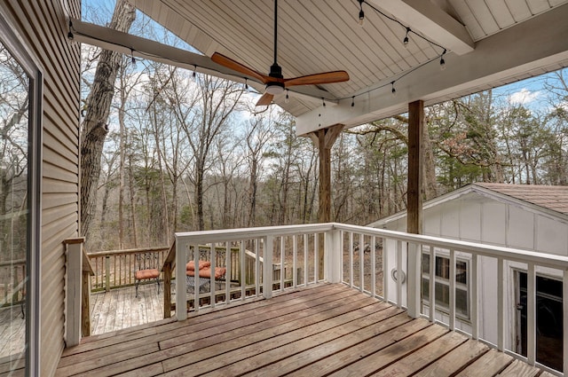 wooden deck featuring ceiling fan