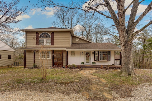 traditional-style house with a porch and board and batten siding