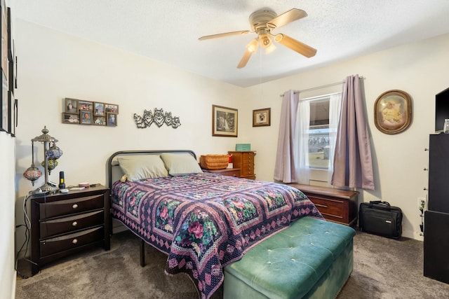 carpeted bedroom with a textured ceiling and a ceiling fan