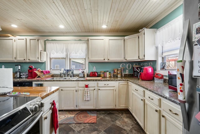 kitchen featuring recessed lighting, wood ceiling, and a sink