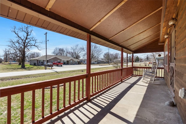 view of patio / terrace featuring a residential view and a porch