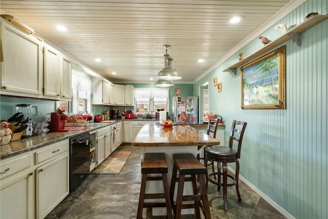 kitchen featuring a center island, pendant lighting, a breakfast bar, black dishwasher, and freestanding refrigerator