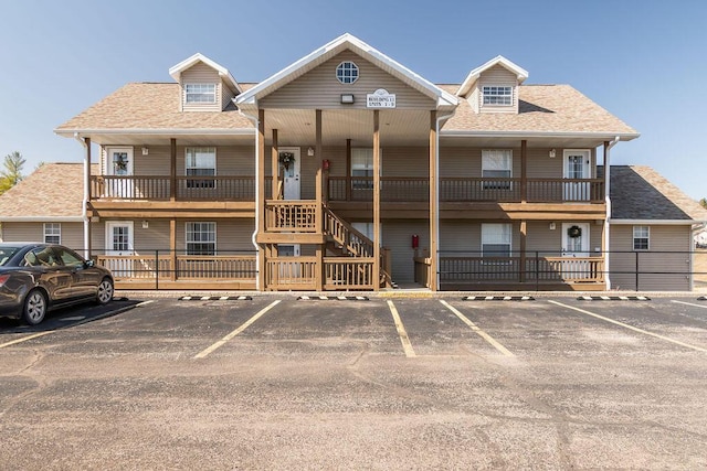 view of building exterior with uncovered parking