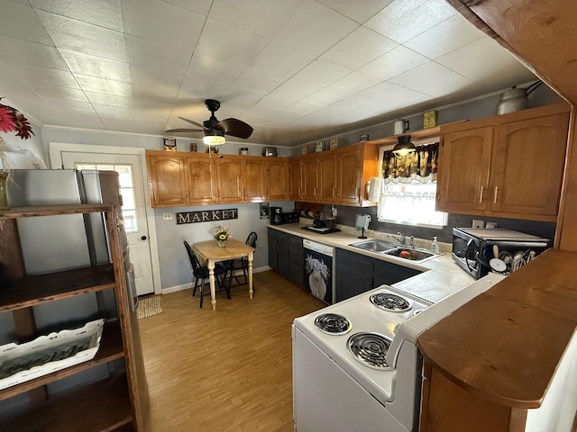 kitchen featuring dishwashing machine, light wood-style flooring, a sink, white electric range, and brown cabinets